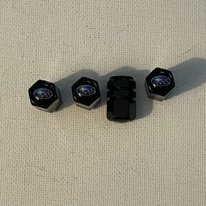 Subaru logo valve Stem caps in black set of 4 NWT